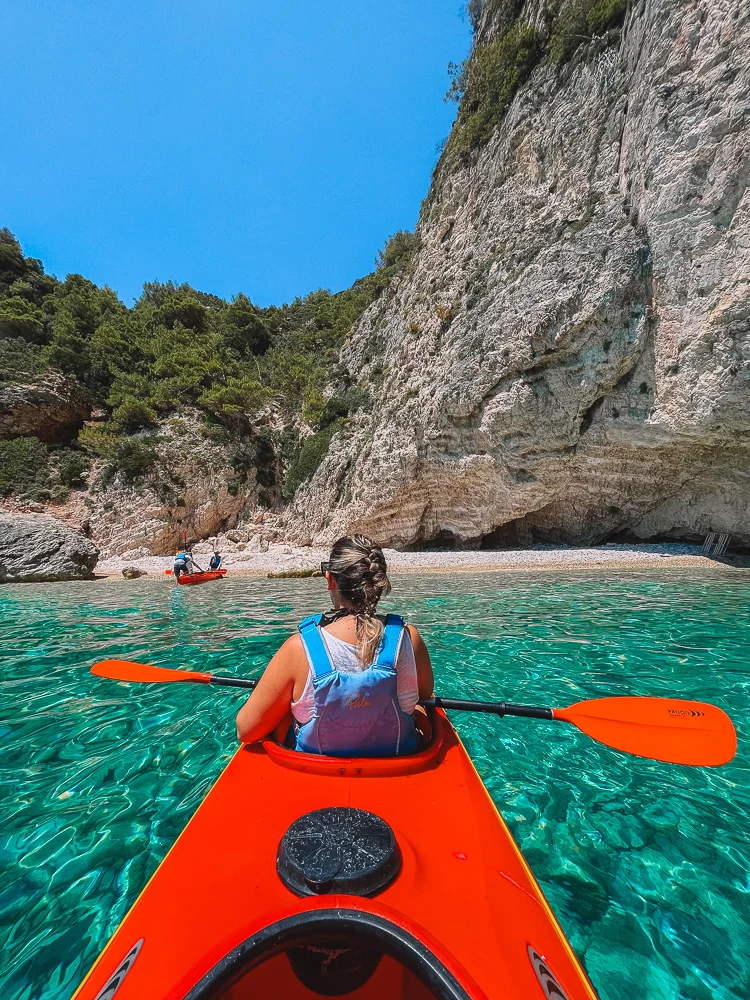Kayaking to a hidden beach during our Keri Caves kayak tour in Zante, Greece