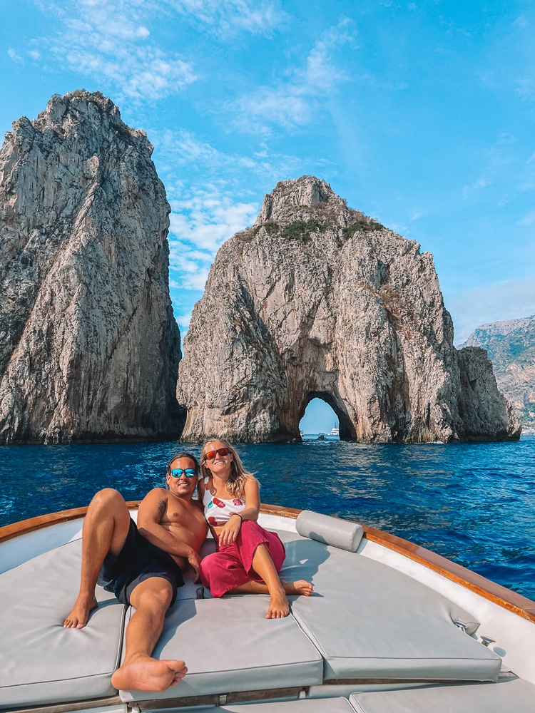 Enjoying our private boat cruise in Capri, with the iconic Faraglioni Rocks behind us - one of the highlights of our Amalfi Coast itinerary