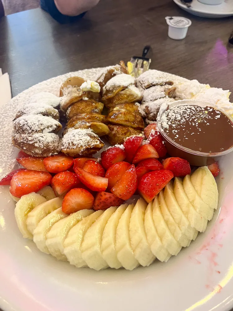 Trying Poffertjes, typical Dutch pancakes, is a must if you visit Amsterdam in a weekend