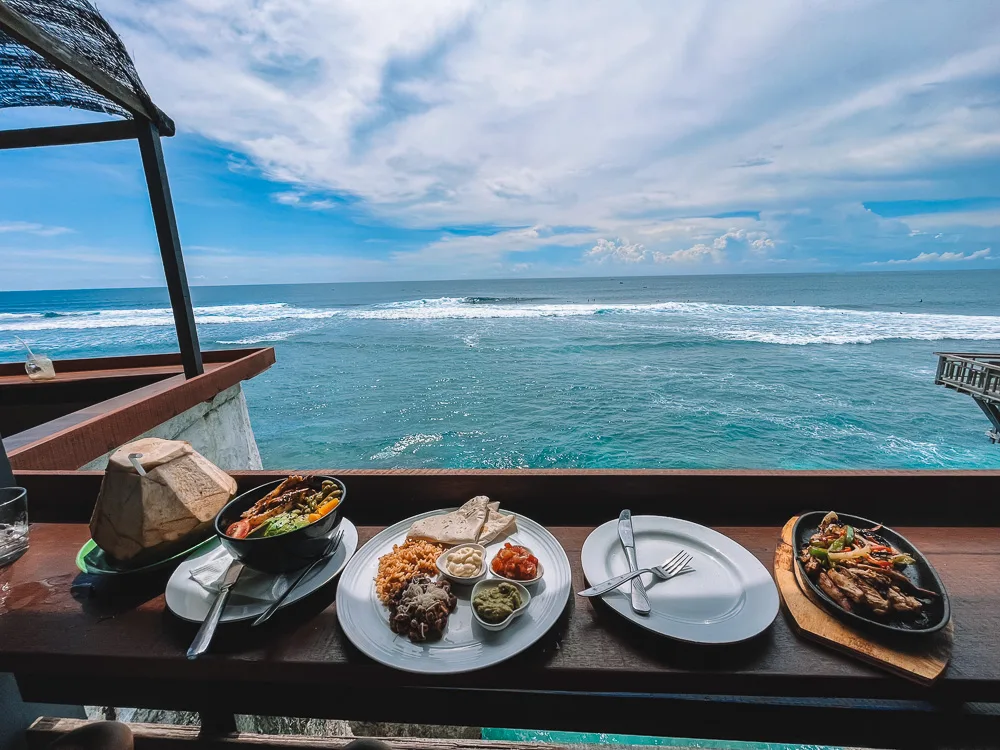 Watching the surfers in Uluwatu from one of the local warungs just above Suluban Beach in Bali