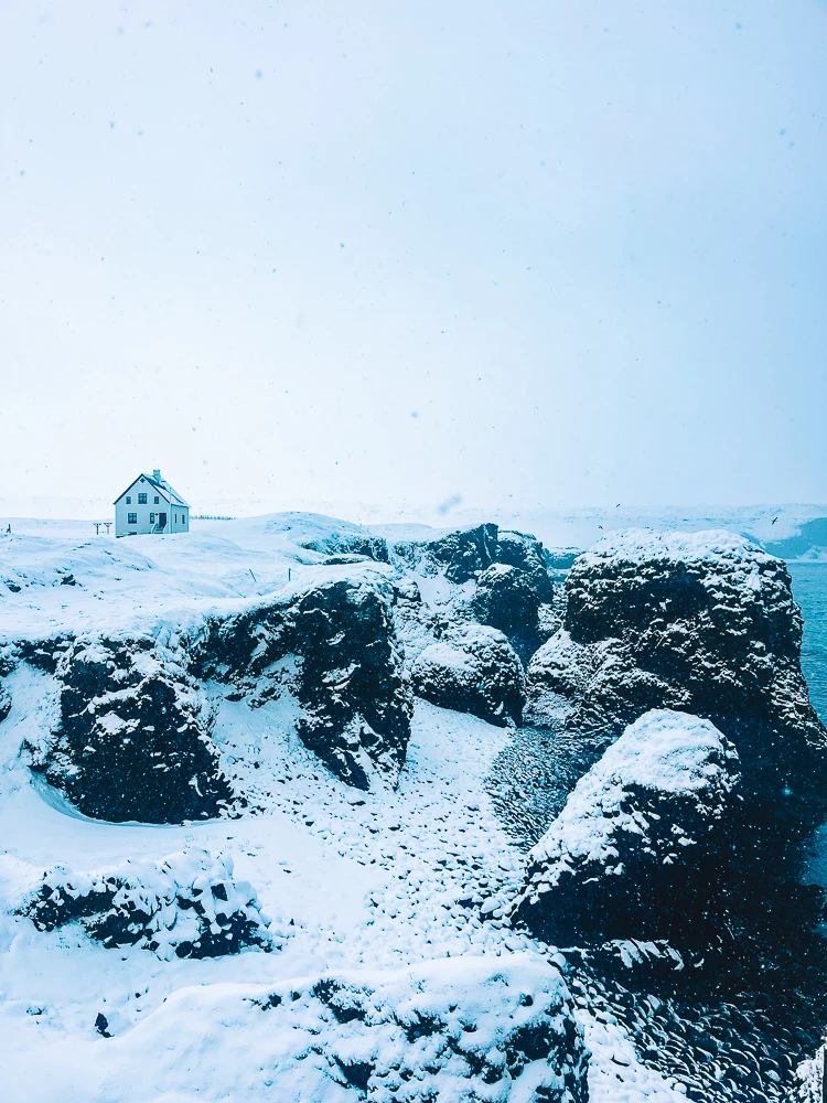 Going for a snowy coastal walk in Arnastapi in the Snaefellsnes Peninsula