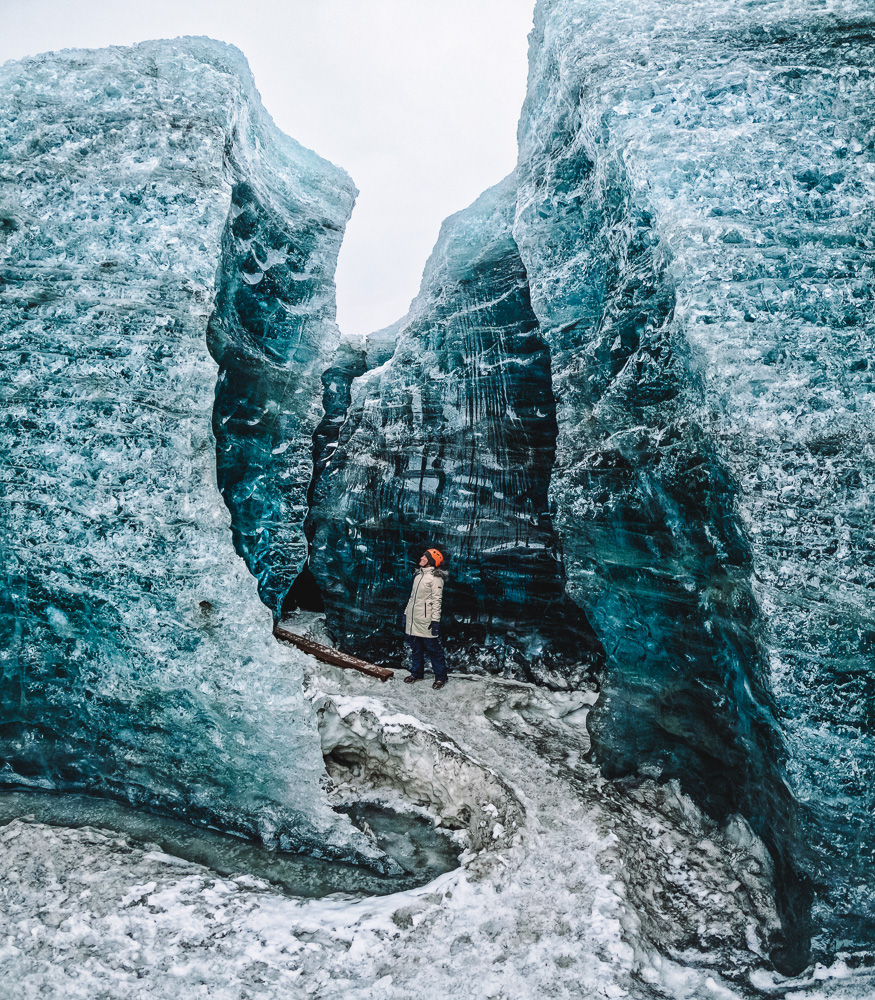 iceland ice caves tour - Standing in awe amidst the towering icy walls – nature's frozen architecture on full display.