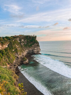 The cliffs of Uluwatu Temple in Bali at sunset