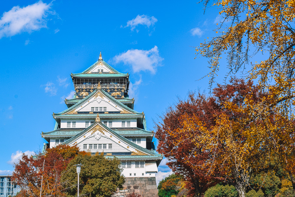 The beautiful Osaka Castle and red autumn colours, Japan