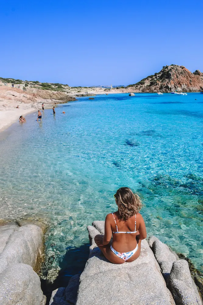 Enjoying the beautiful turquoise water of Cala Corsara on Spargi Island, in Sardinia, Italy