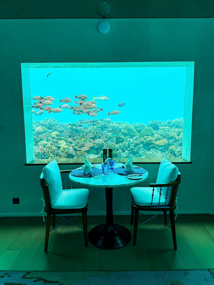 Table with an underwater view at Only BLU, the largest underwater restaurant in the Maldives