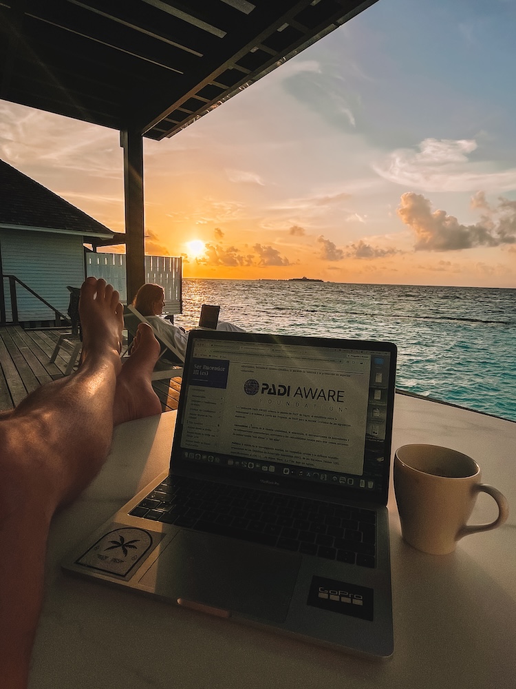 Studying for our PADI Open Water course from the deck of our Water Villa at Nova Maldives
